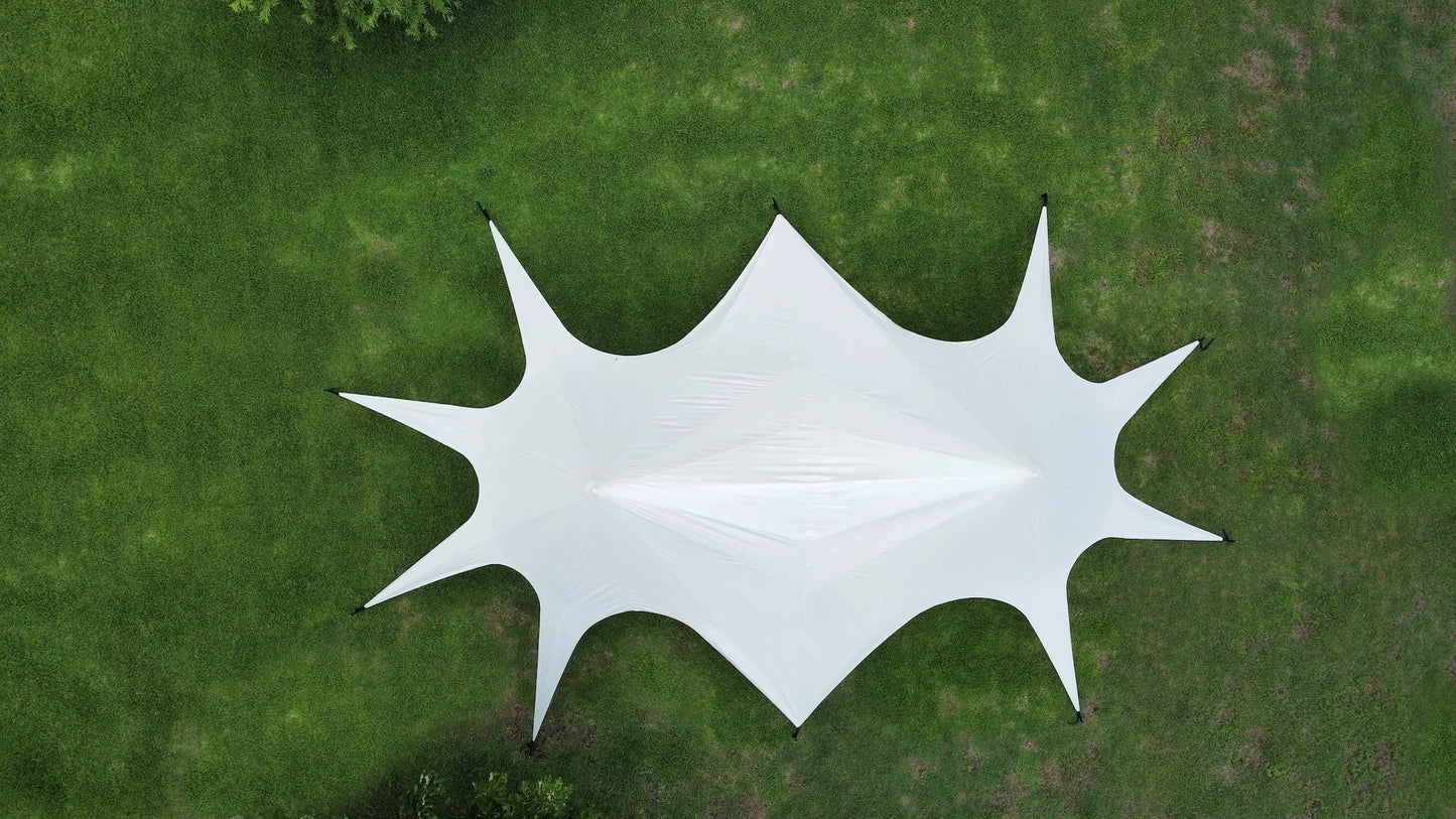 White twin star canopy on a grassy field