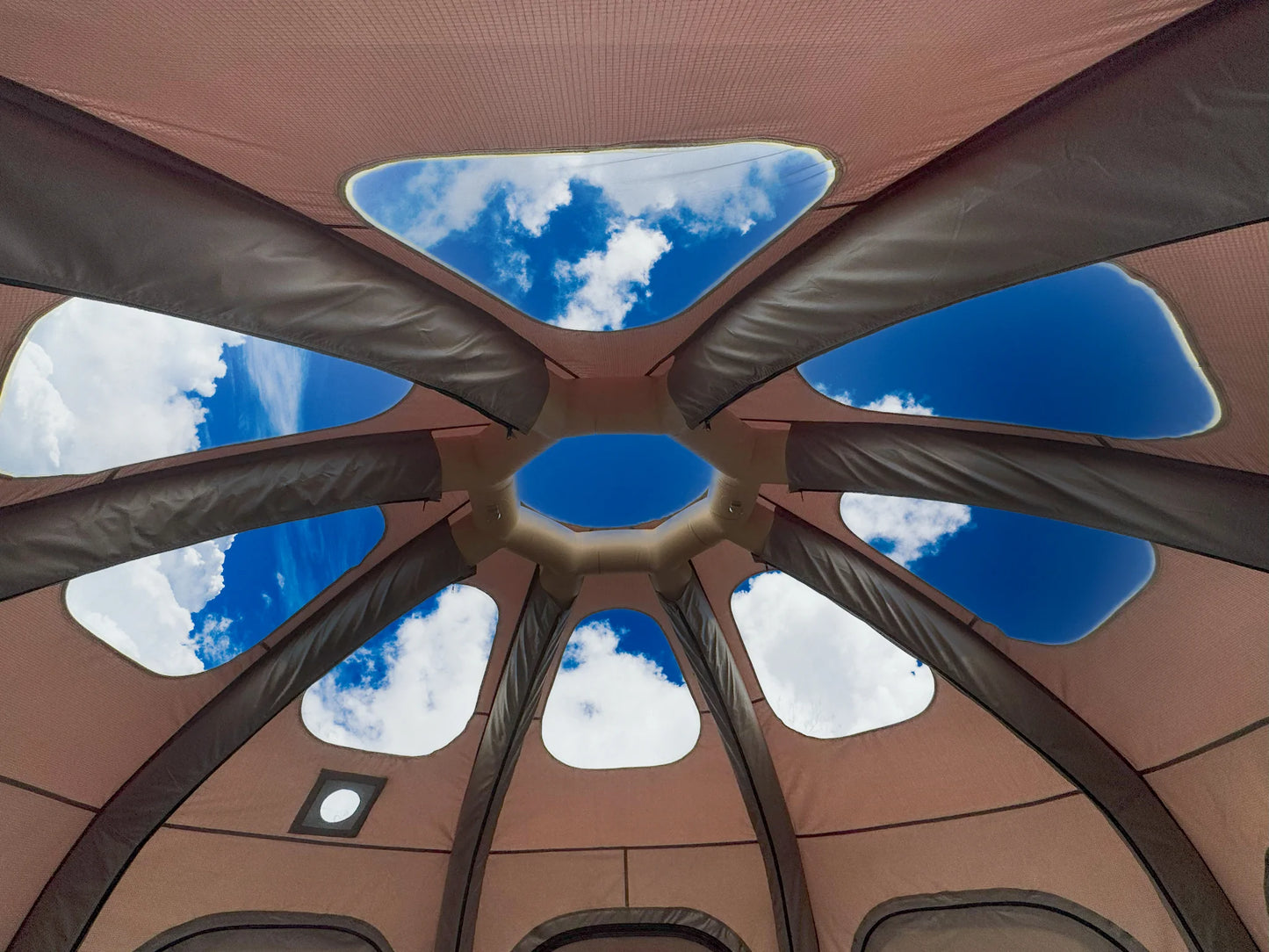 Ceiling with geometric design and blue sky view