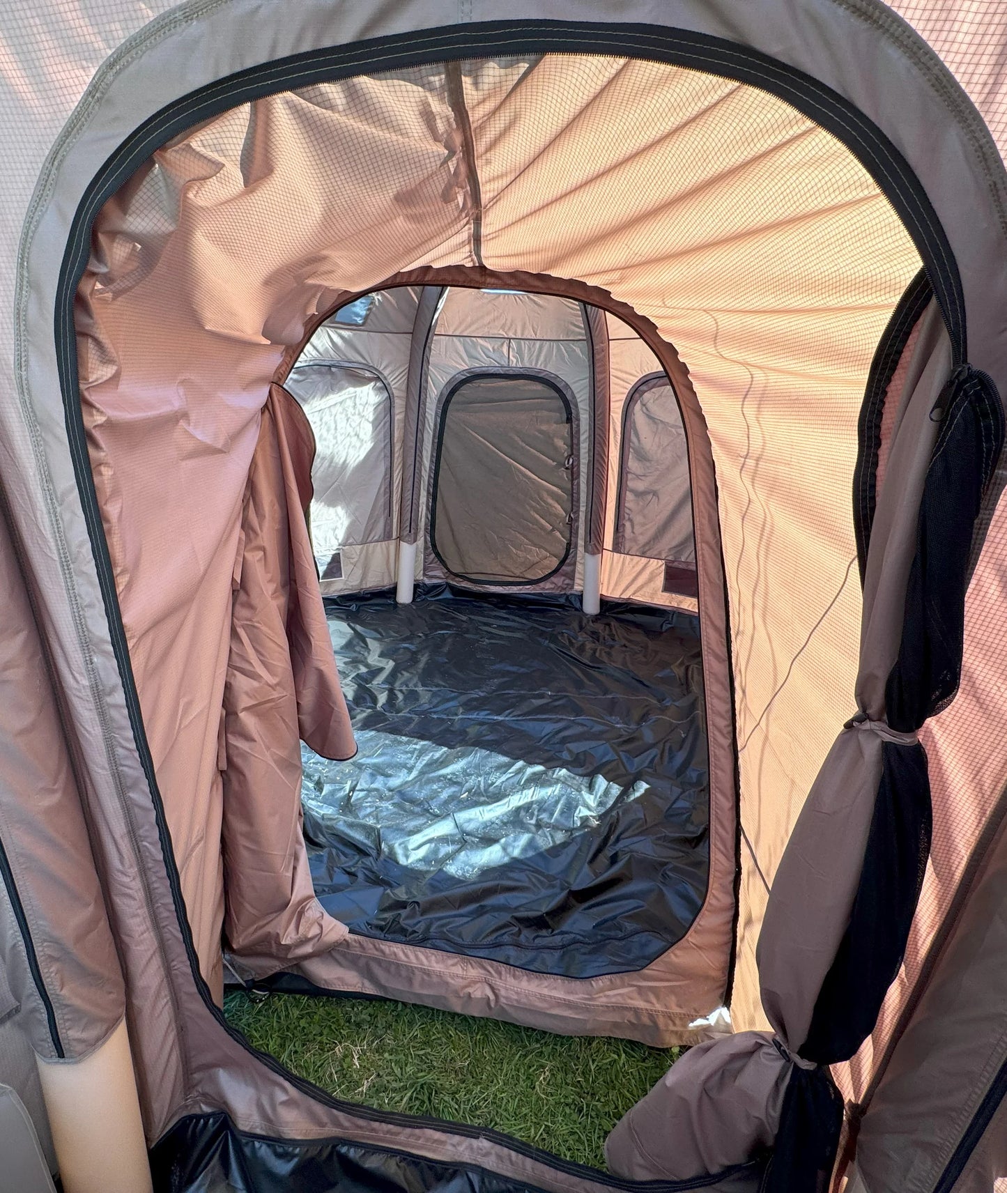 Pop-up tent with interior view on a grassy surface