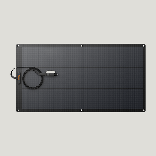 Black solar panel with a cable on a white background