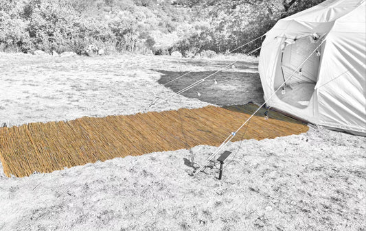 Lush path of bamboo leads to a grand luxury tent, promising an unparalleled glamping experience amidst nature’s embrace. Ideal for those seeking adventure coupled with comfort and elegance