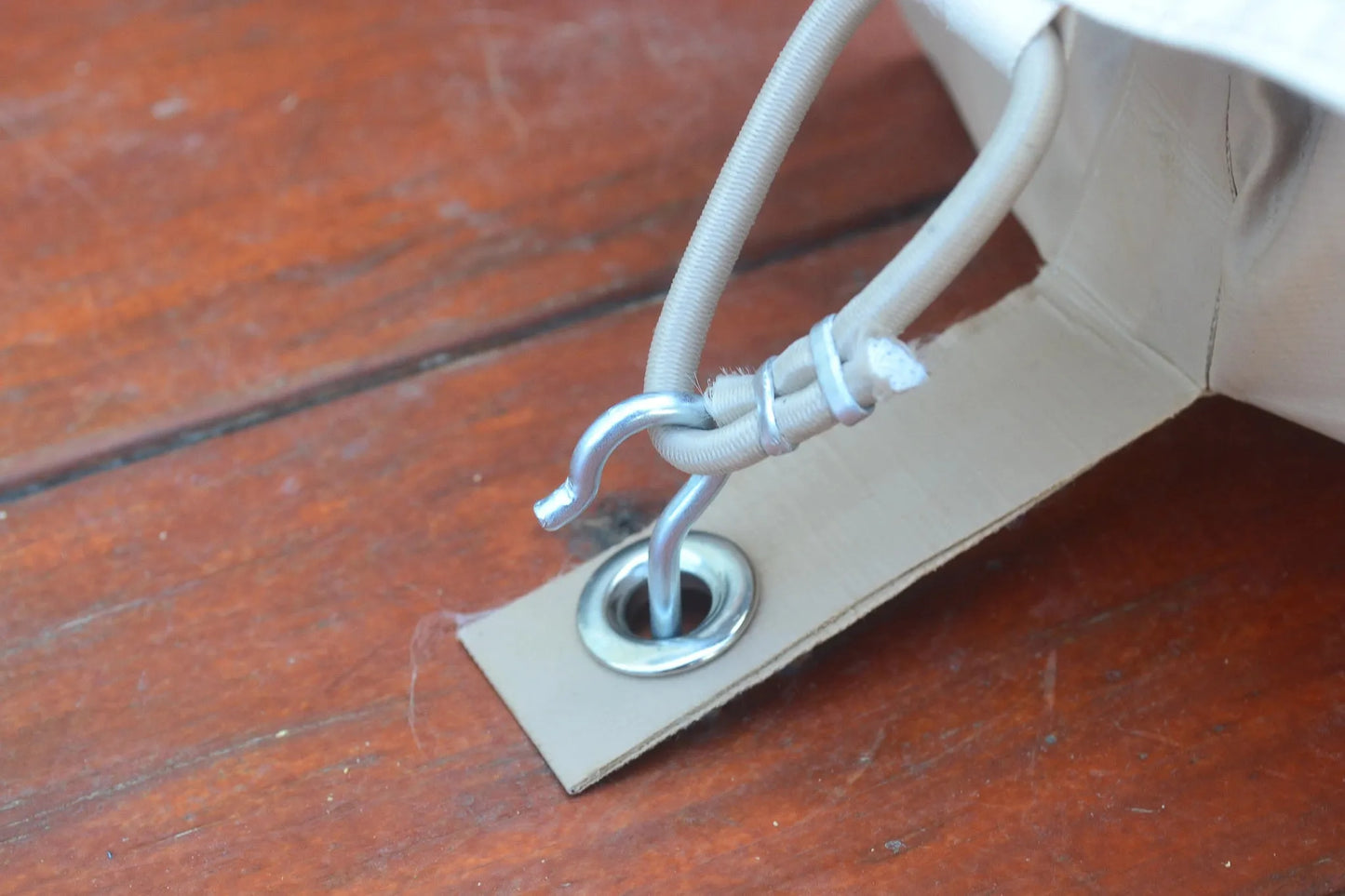 Specialized threaded hook stake in use on a deck