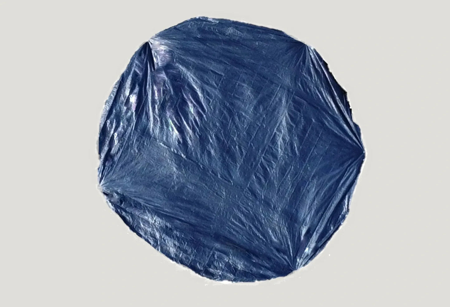 Durable ground sheet spread under a tent, offering additional protection and insulation against rough terrain and cold ground.