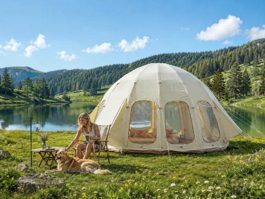 A dog relaxing with its owner outside of a glamping tent in a summery valley by a lake