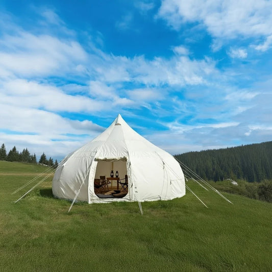 Best glamping tent for beginners showing Eclipse bell tent setup with comfortable bedding and furniture in mountain camping location