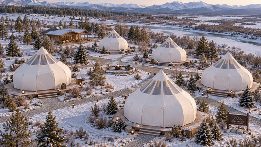 A quiet glamping site in the off-season with tents standing in a calm winter landscape