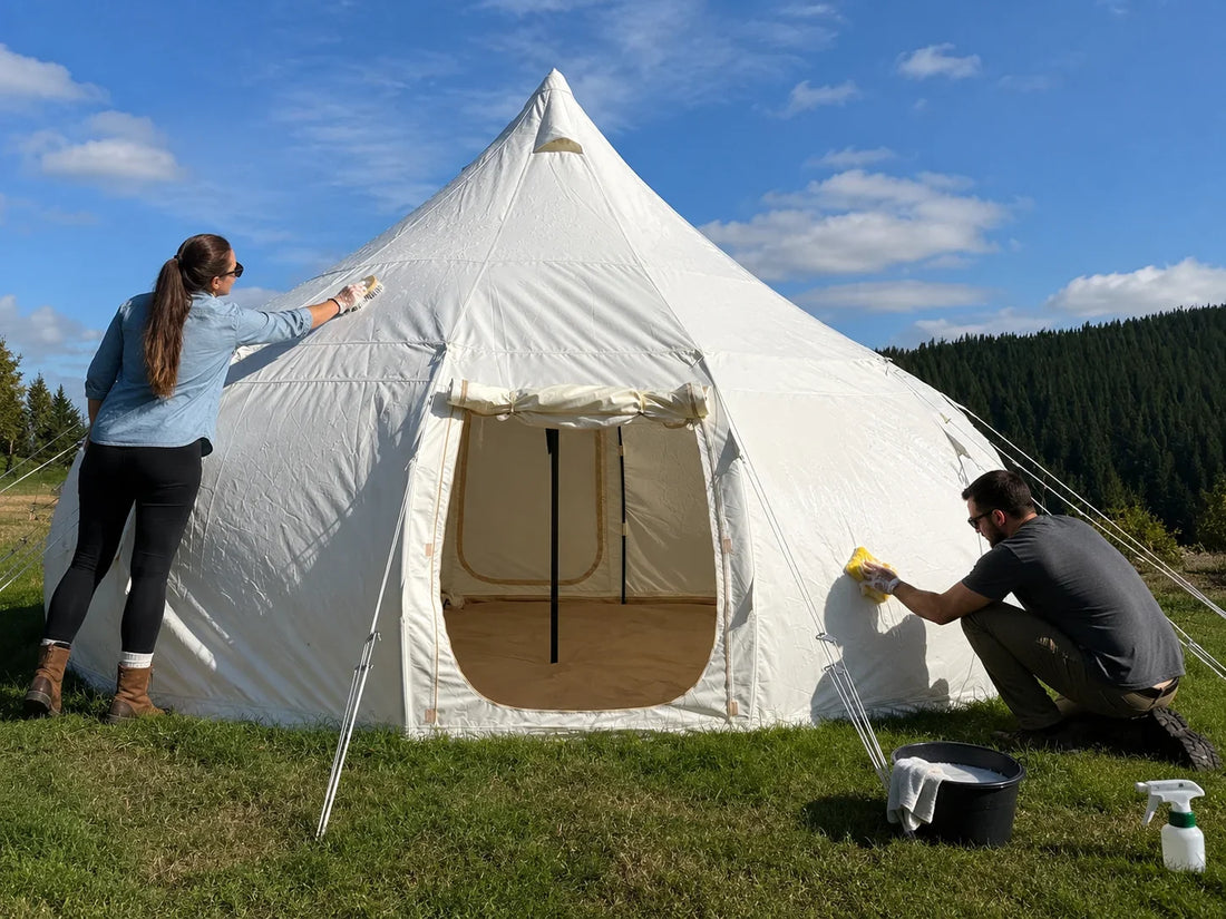 A clean canvas glamping tent air-drying in the sun before end-of-season storage