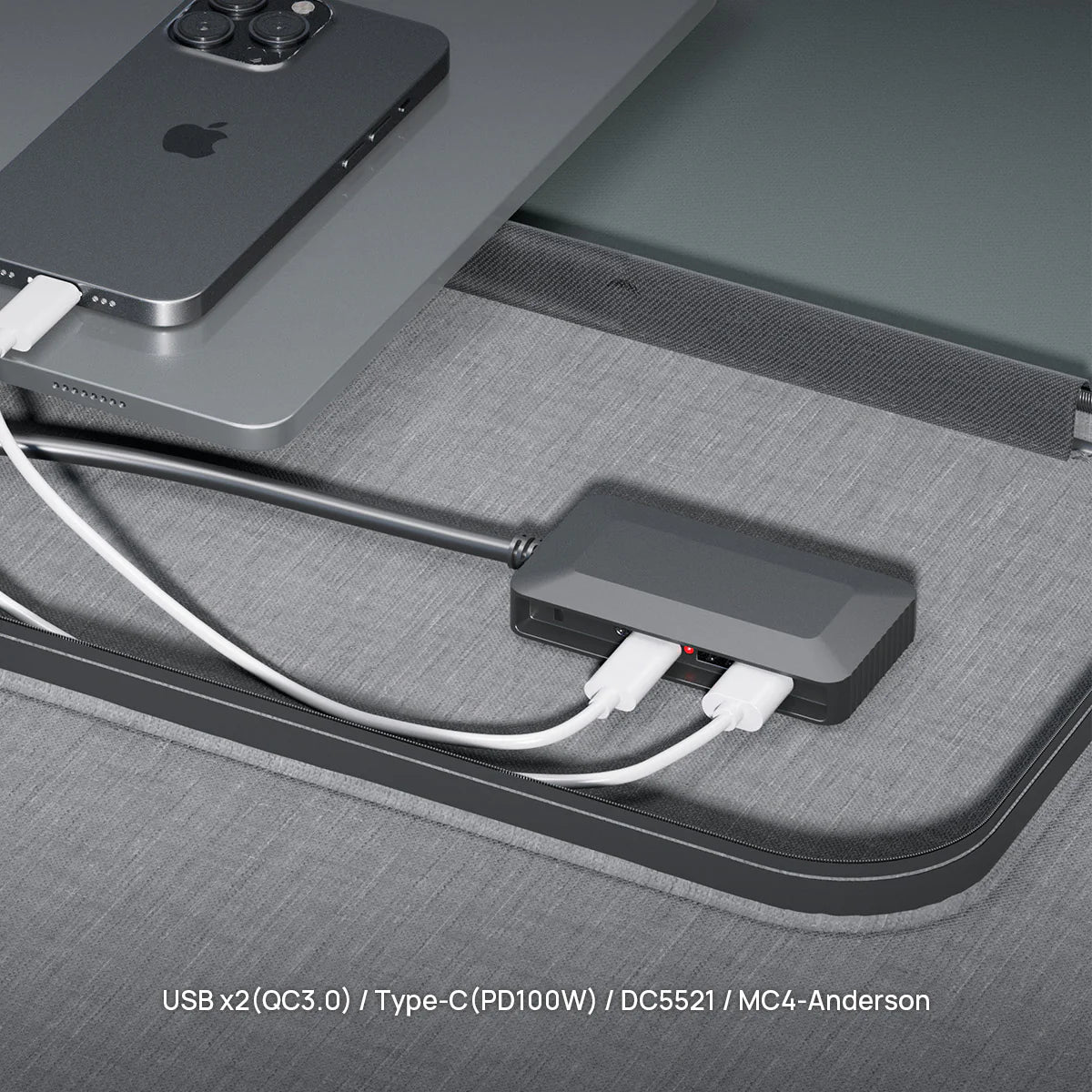 USB hub connected to a smartphone and tablet on a gray surface