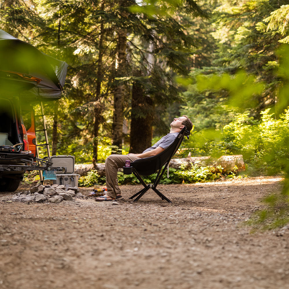 Black CLIQ EpiQ lounge chair in a scenic outdoor setting
