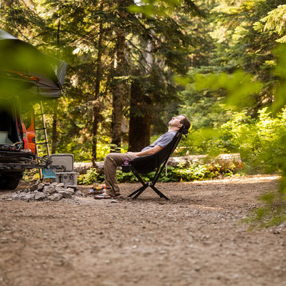 Black CLIQ EpiQ lounge chair in a scenic outdoor setting