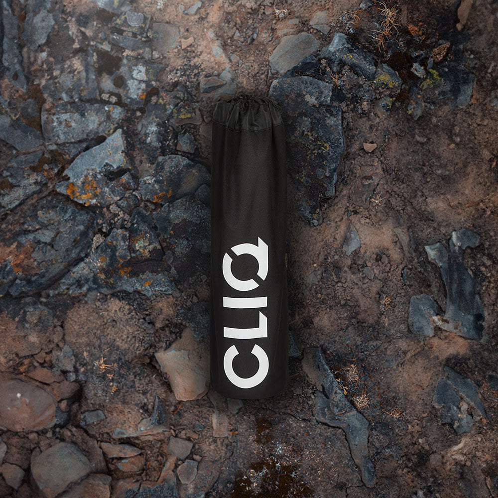 Black CLIQ EpiQ reclining chair at an outdoor gathering