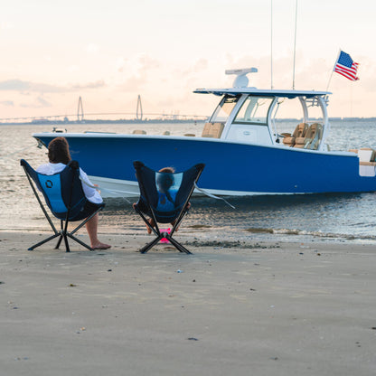 Family relaxing on a sandbar with CLIQ MystiQ lounge chairs