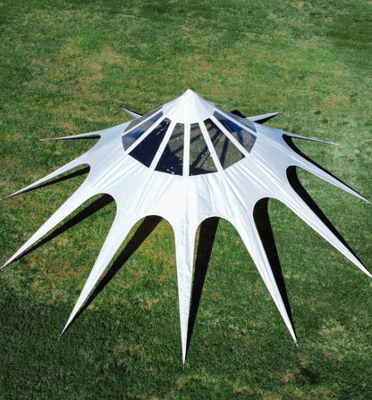 White geometric sculpture on a grassy field