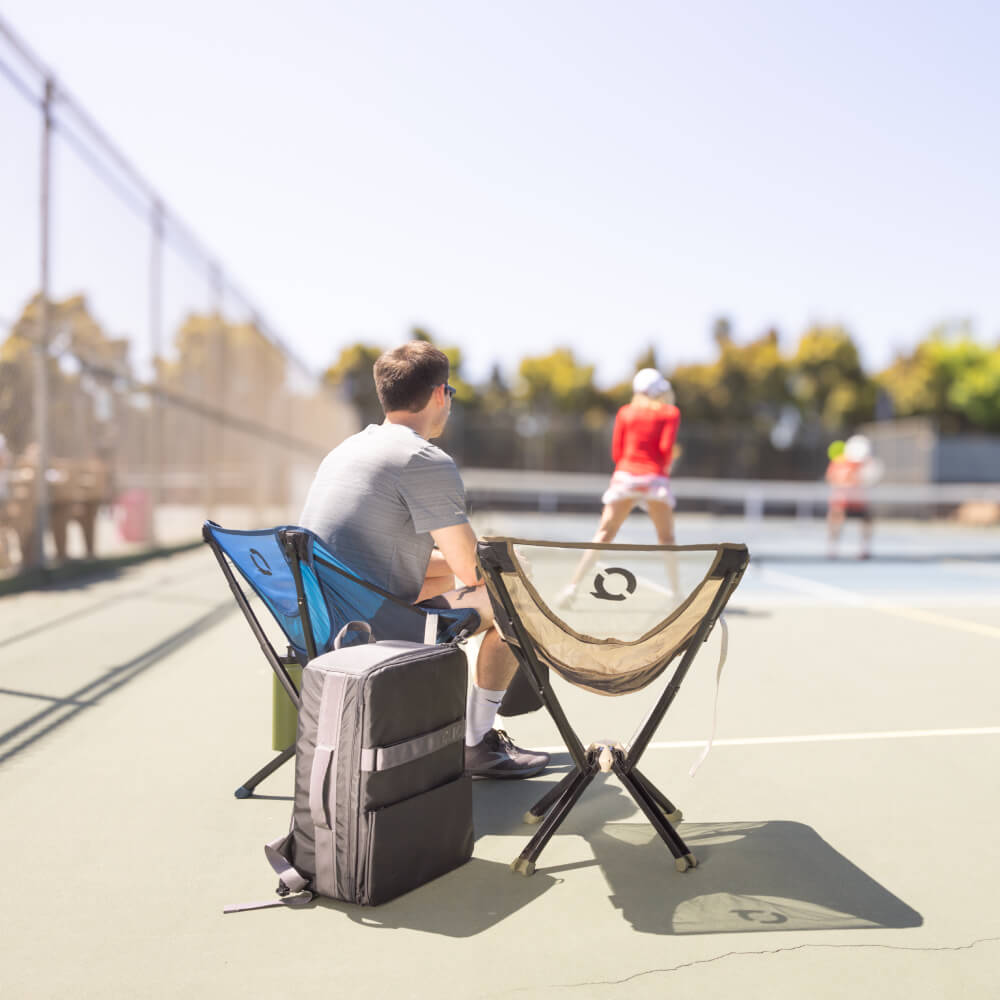 CLIQ ClassiQ chairs on the sidelines at a pickleball court